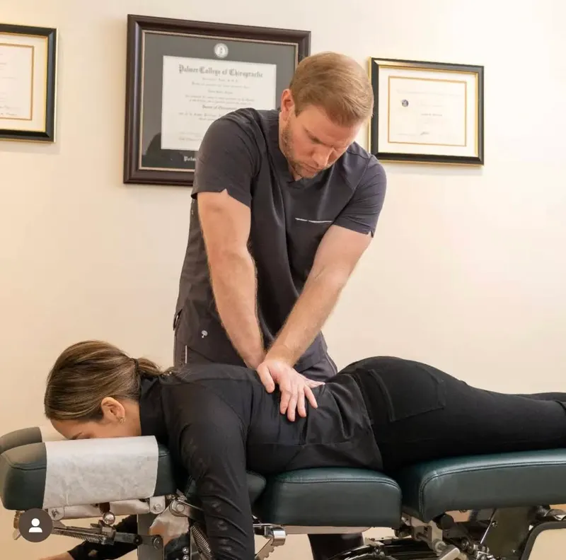 Dr. Jason adjusting a patient