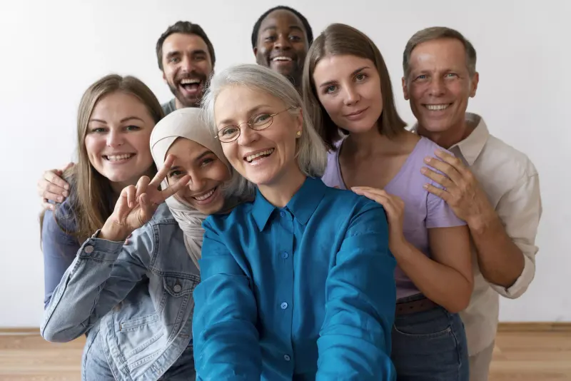 A group of adults smiling together